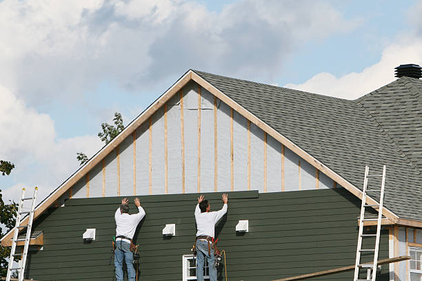 Professional Siding Repair technician working in White Hall, WV